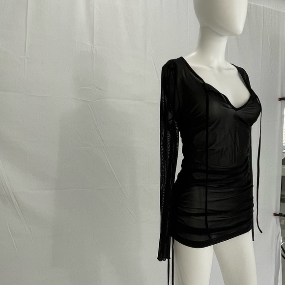 Bathing suit Cover up. Black ruched sides with adjustable strings. See through. - Picture 2 of 3